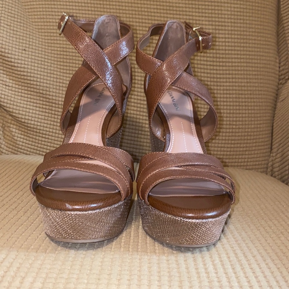 Wedge heels size 9.5. Color Tan or brown color. Excellent condition.